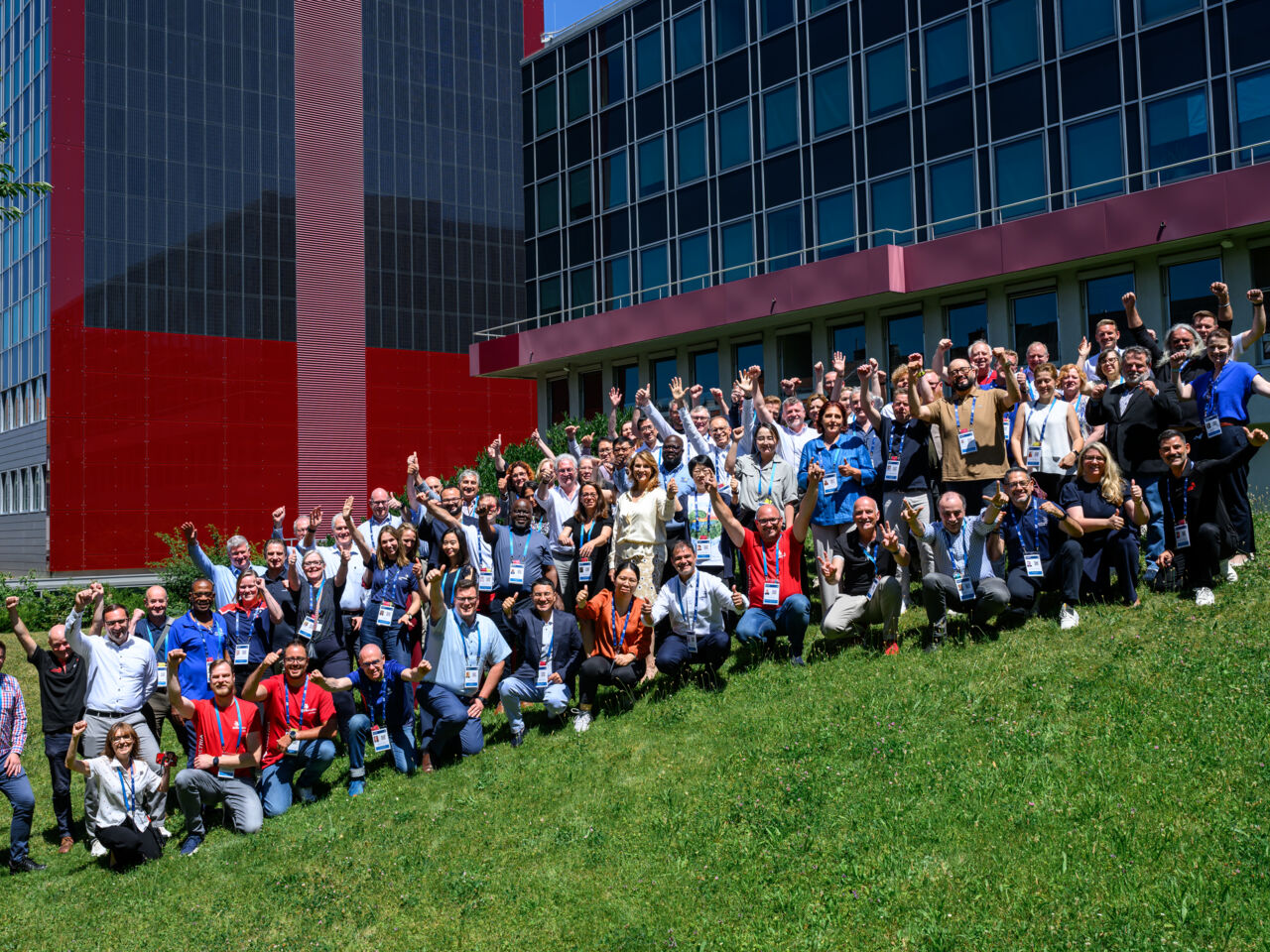 Participants pose on a grassy slope for a group photograph at the first face-to-face workshop held on 1-3 July in Vienna, Austria. 

