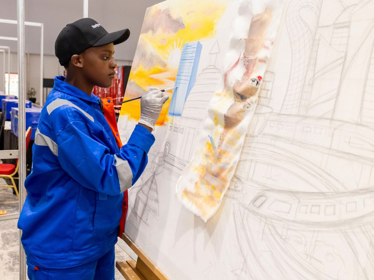 A competitor painting at the the WorldSkills Rwanda National Skills Competition in Kigali in June 2025